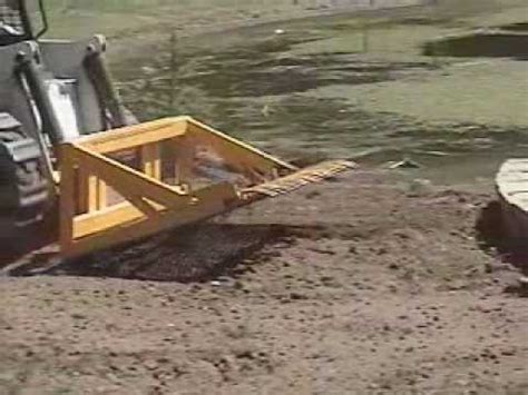 homemade skid steer land leveler|leveling ground with a bobcat.